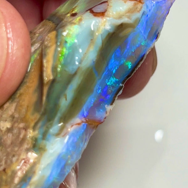 Huge Chucky Stacked Seam Opal rough 72.00cts Stunning Thick Blue Crystal bar sat on second bar of multifires on dark base 45x17x15.mm NEW922