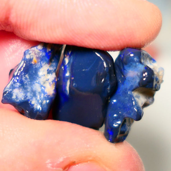 Lightning Ridge Rough Opal 26cts Blacks seams Trio showing some Blue fires 22x12x8mm to 16x9x7mm A1516