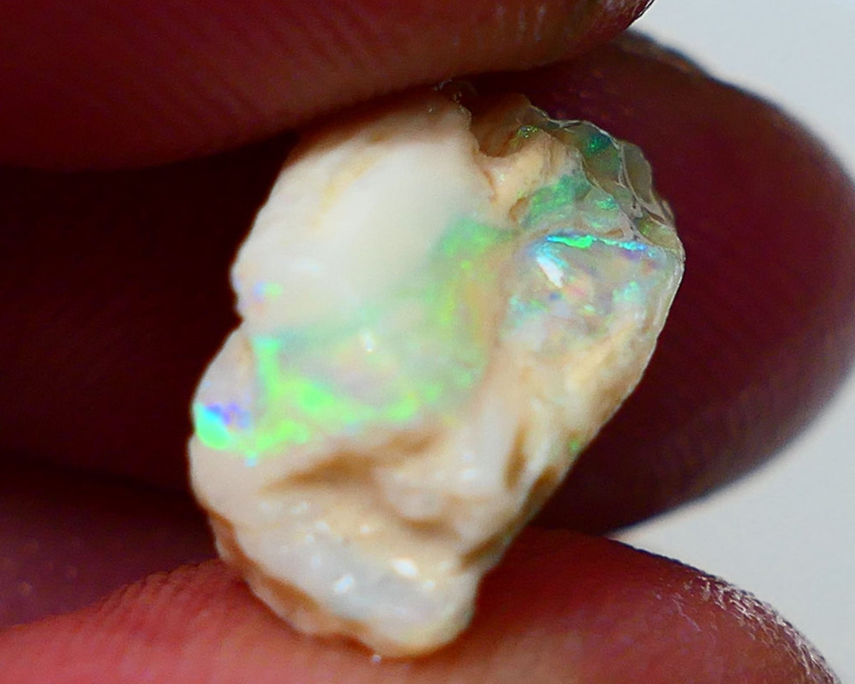 Lightning Ridge Rough Opal 7.15cts Light Base Seam showing  Bright multi colours 17x9x8mm NS311