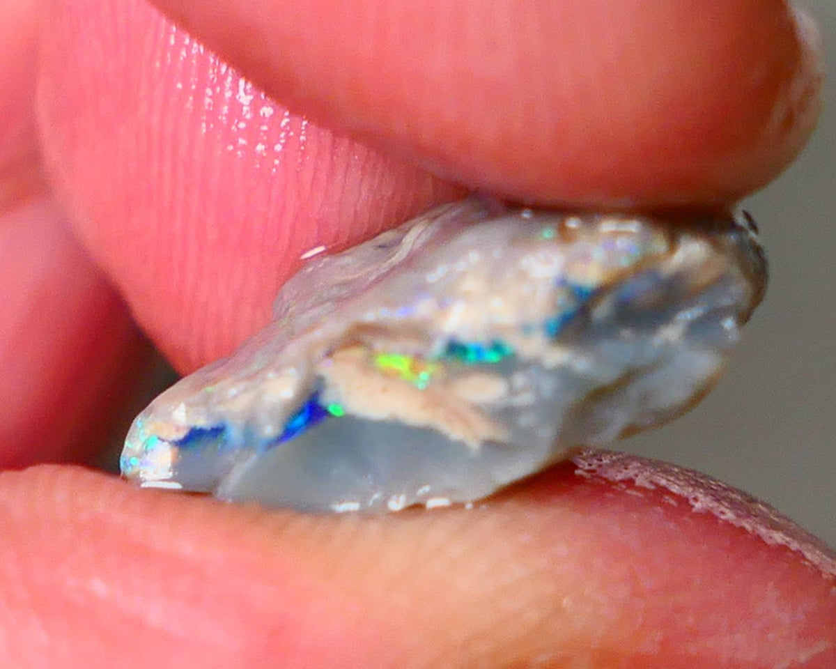 Lightning Ridge Seam opal rough 6.05cts showing Gemmy Very bright consistent flt bar with multi colours to cut worth a gamble on this one cut a gem 16x12x6mm ALP117